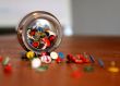 thumbtacks in a glass