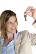 woman shows key