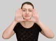 Hands near the face.