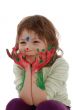 cute girl with painted hands and face