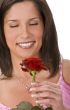 Portrait of a girl with a red rose