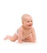 Funny little girl lying on white bed over white background
