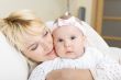Mother embrace her baby girl