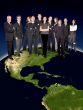 business team on top of the world