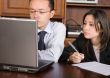 business partners on a laptop