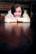 business woman leaning on a desk