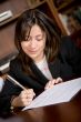 business woman signing a contract