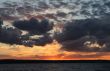 dark and light clouds on a sunset over Volga.