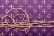 Paper cord knot over purple wrapping paper