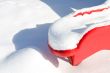 Red Plastic Slide in Snow