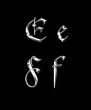 Silver letters E, F