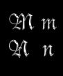Silver letters M, N