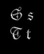 Silver letters S, T