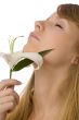 young girl smelling lily