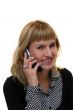 young woman with mobile phone is smiling in office