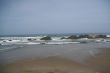 Waves breaking on volcanic rocks