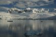 Reflections of glacial icefalls and mountains