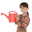 Adorable girl watering