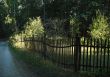 fence on sunset rays