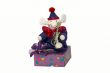 Clown sitting on a box