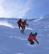 Multiple exposure: Red skier in powder snow