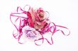 two artificial roses, convoluted in purple tape