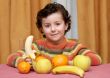 child eating fruit