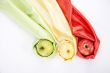 three apples of different colour wrapped in silk