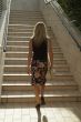 Blonde girl walking on stairs