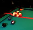 Photo of pool table and balls