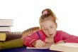 young girl is studying the books