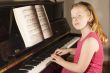 little girl playing the piano