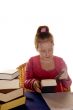 young girl is reading a studybook