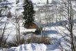 Old western barn in snow with aspens