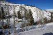 Old western cabin in snow with aspens