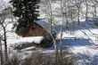 Old western barn in snow with aspens