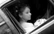 Bride in wedding car limousine
