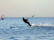 Silhouette of a kite-surf on waves of a gulf 1