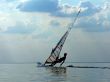 Silhouette of a wind-surfer on waves of a gulf