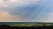Sun beams through clouds.