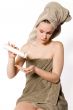 Woman is getting some creme on her hand