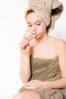 Young woman is brushing her teeth