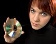 Girl holding a compact disc