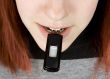 Girl biting a flash drive