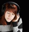 Pensive girl listening to music
