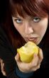 Seductive girl eating apple