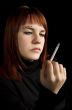 Girl watching her cigarette