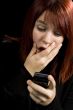 Girl amazed after checking her mobile phone