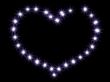 Heart from shining stars on a black background