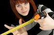 Girl using a measuring tape tool